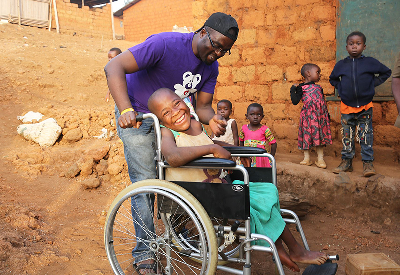 Precious from Cameroon in her new wheelchair